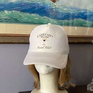 This white trucker hat features a screen for an "Espresso Martini Social Club".